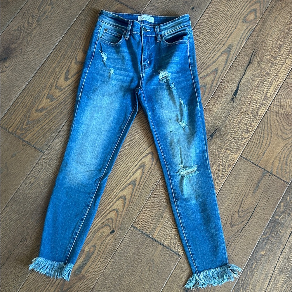 Stylish Distressed Blue Jeans with Fringe Hem
